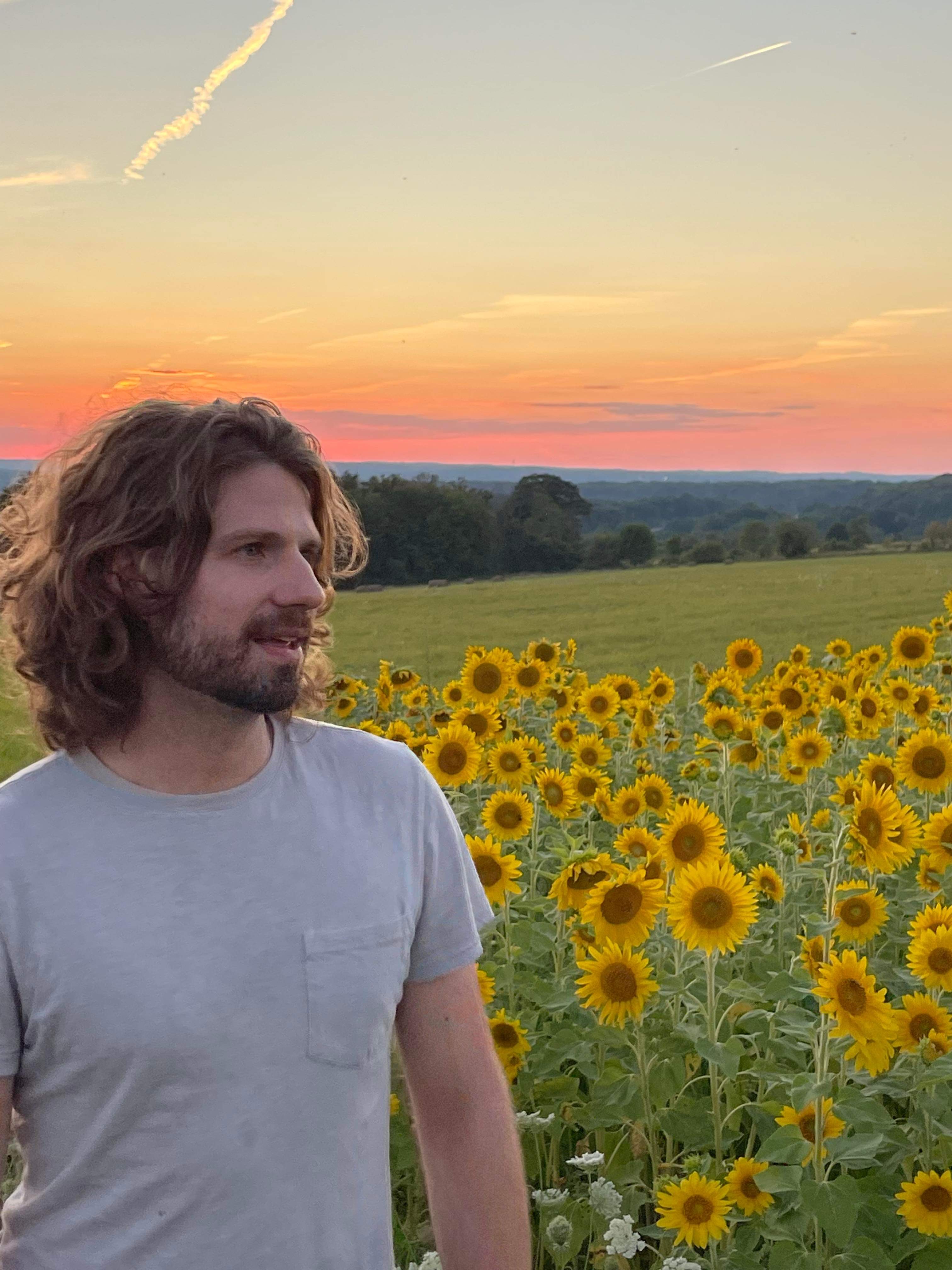 picture of Sean Nimmo in front of sunflowers